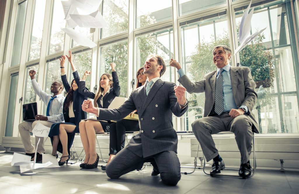 Group of businessmen celebrating the business victory